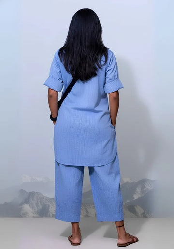 Women wearing a relaxed-fit blue co-ord set with pockets